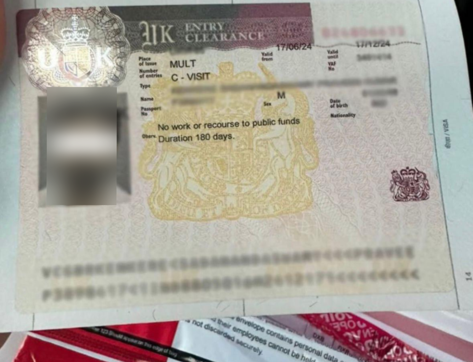 United Kingdom Entry Clearance — approved client passport (personal details redacted)